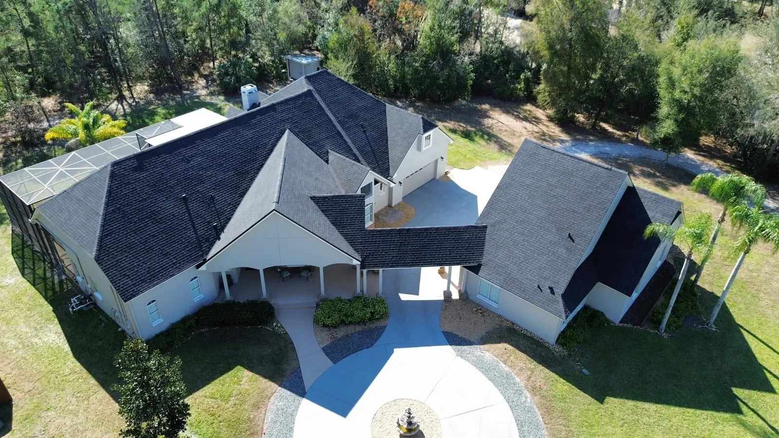 Dark architectural shingle roof on a Sanford home with a circular drive