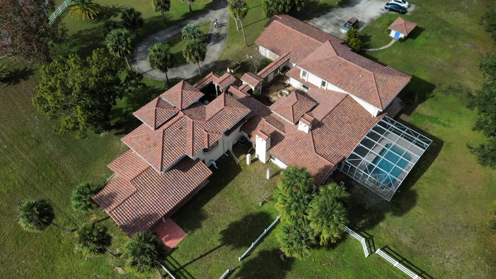 Drone view of the Port Orange home's tile roof and pool enclosure