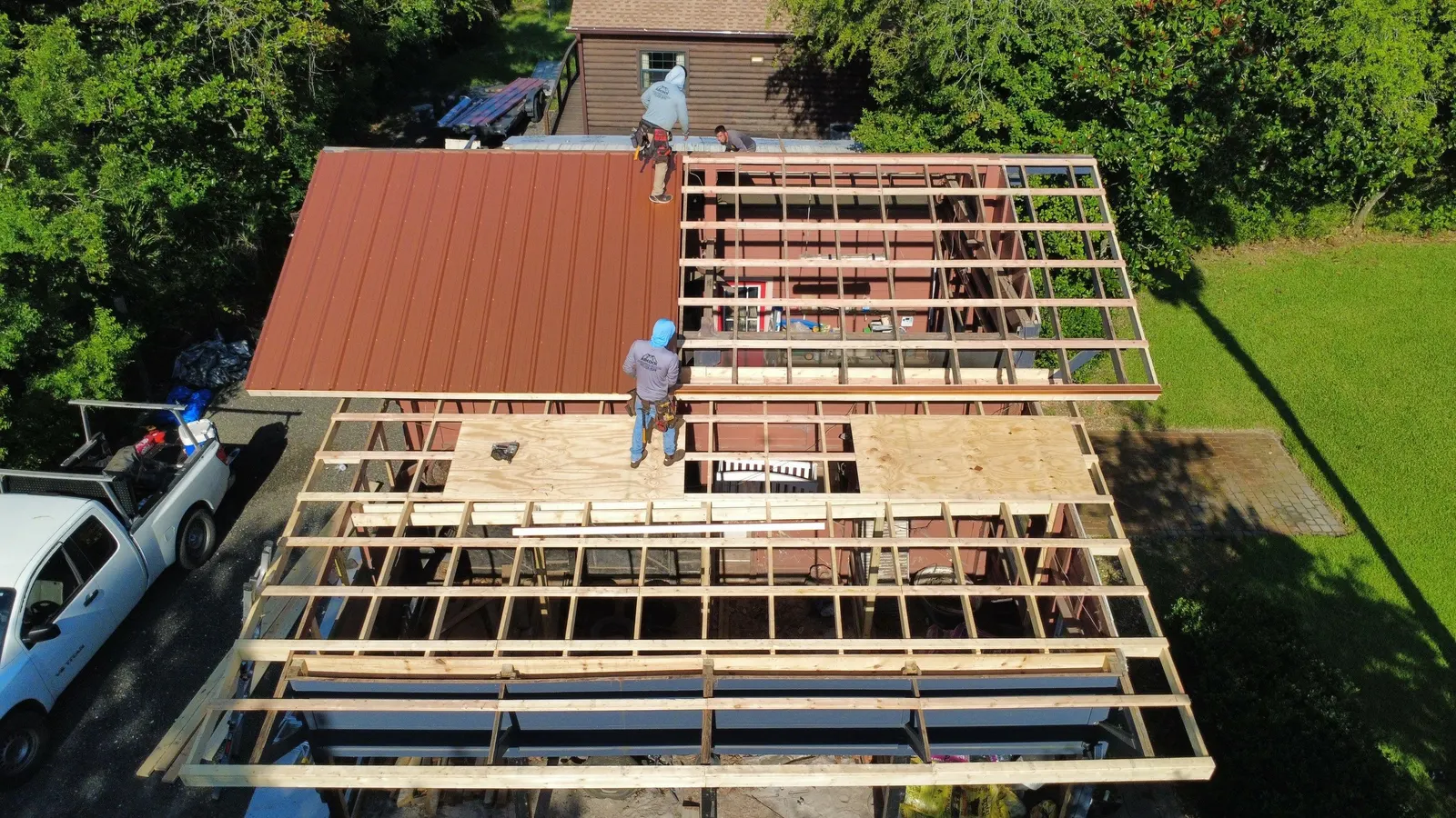 New roof framing on the Edgewater barn as copper PBR panels go on