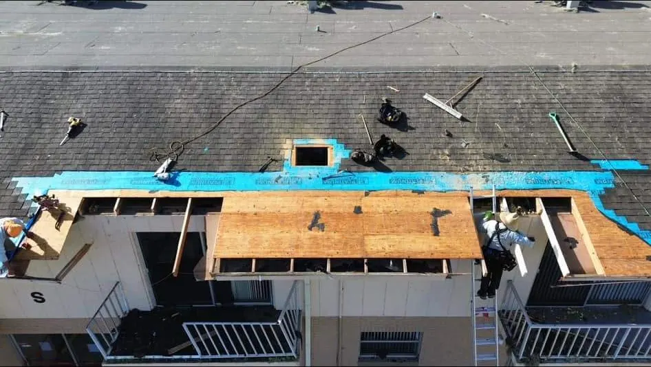Damaged multifamily roof opened up and re-decked after the storm