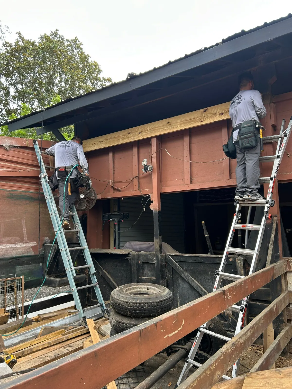 Adcock crew re-framing the Edgewater barn from ladders