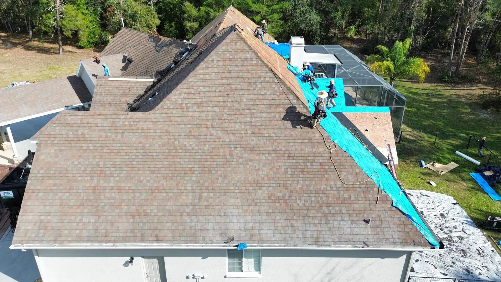 Crew tearing off the old shingles in Sanford
