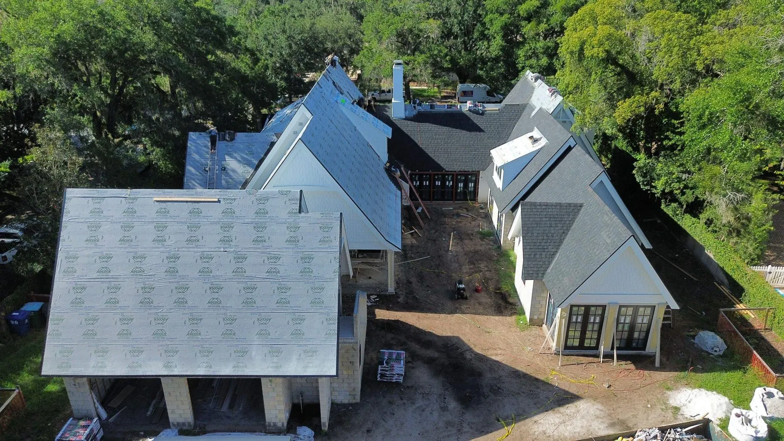 Underlayment going down across the Winter Park roof before shingles
