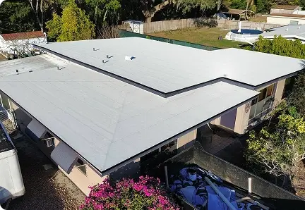 New white low-slope flat roof on a Florida home